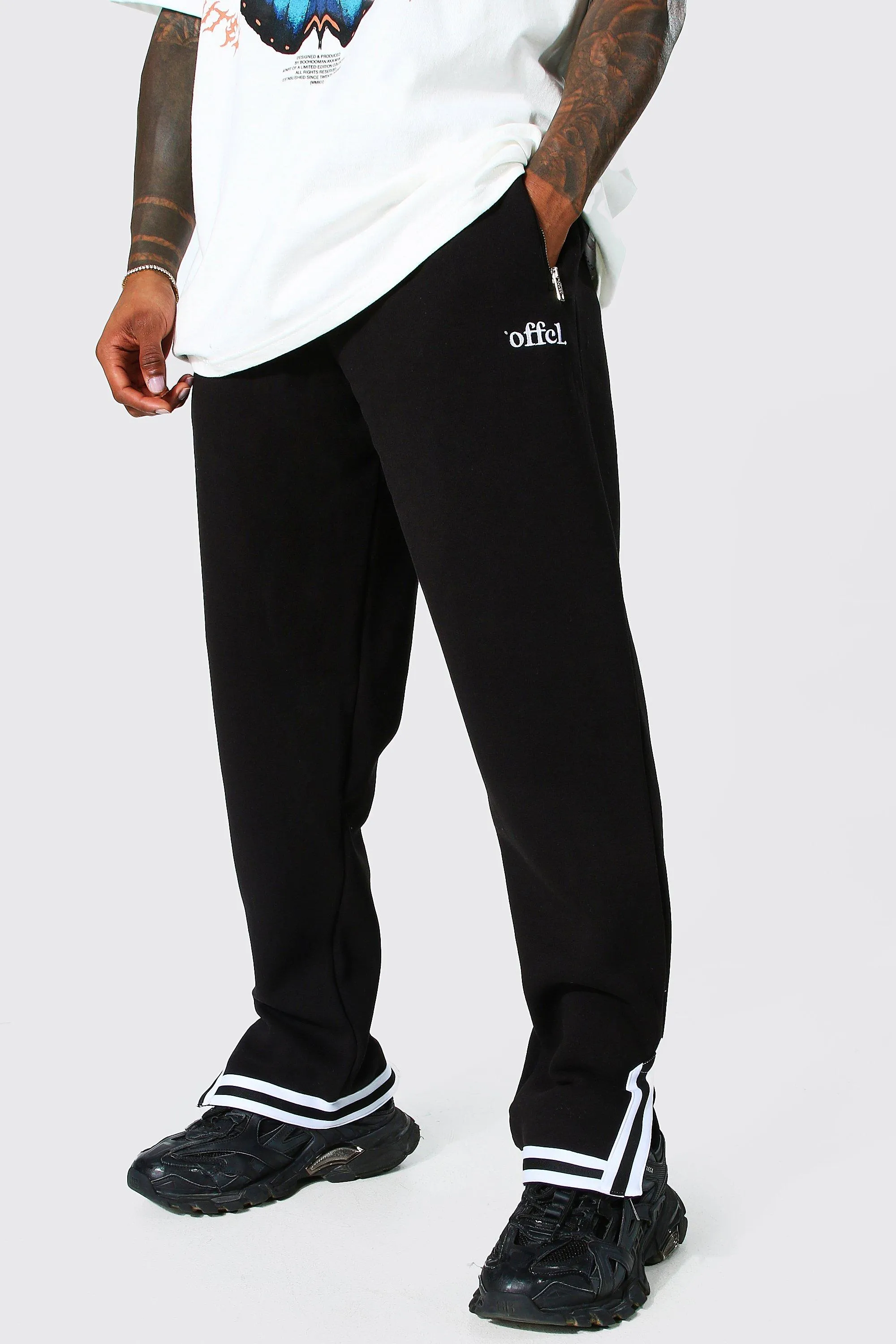 Jogginghose mit Streifen am Bündchen und geteiltem Saum, Loose Fit